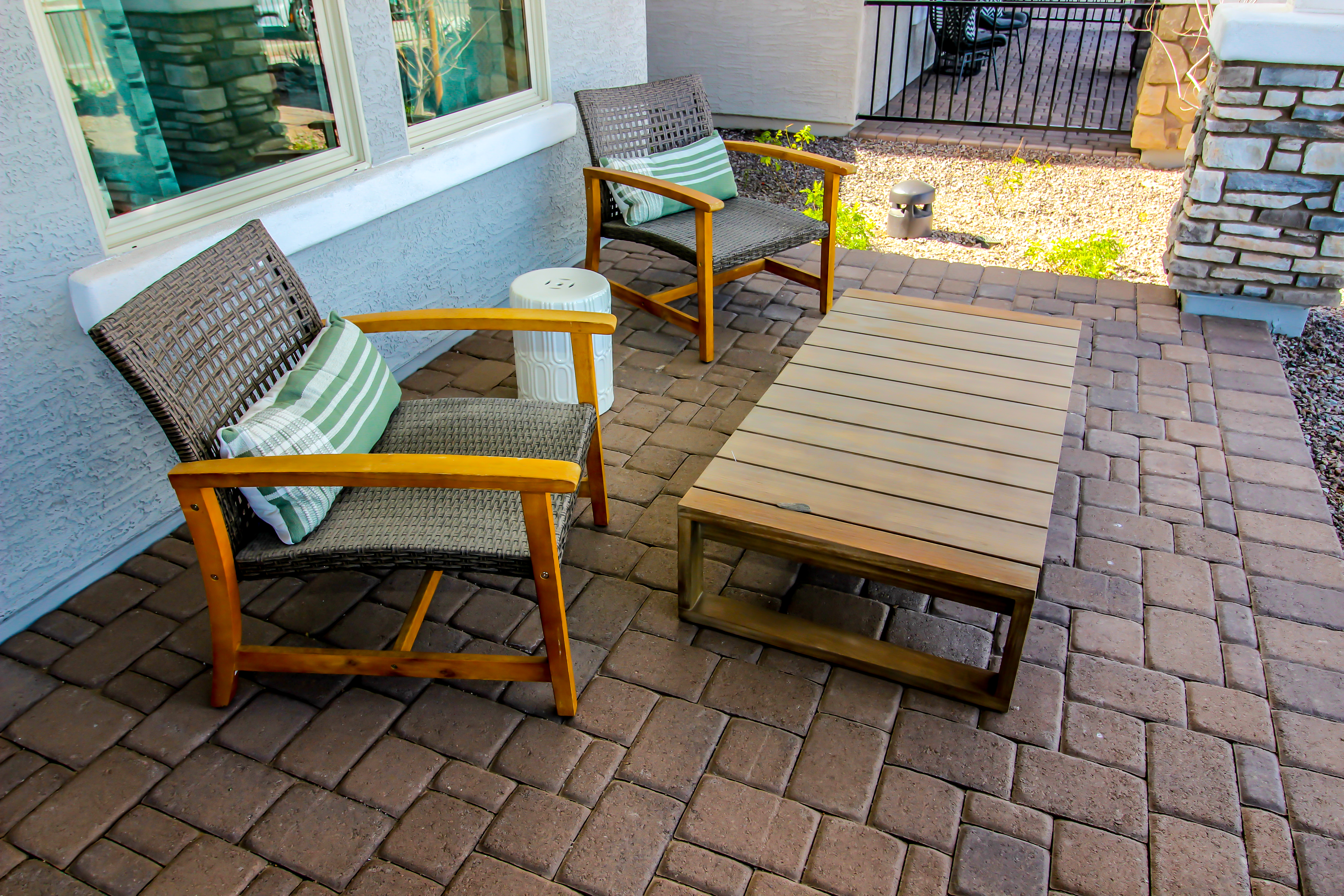 Front Pavers Patio With Table And Two Arm Chairs